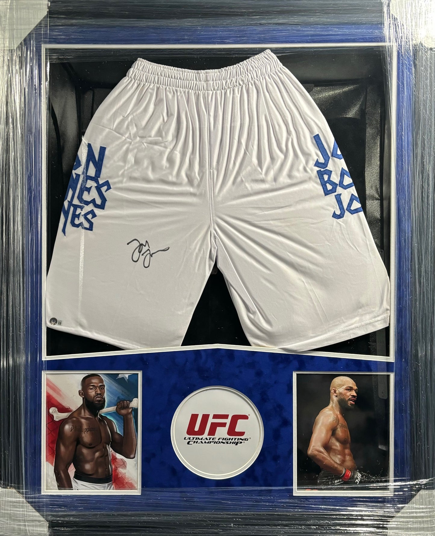 UFC Heavyweight Champion Jon "Bones" Jones Hand Signed Autographed White Trunks Framed & Suede Matted with BECKETT COA