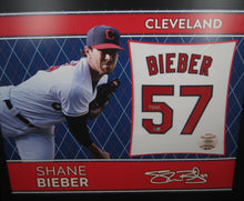 Load image into Gallery viewer, Cleveland Indians Shane Bieber Signed Jersey Swatch Mounted Inside of Picture Frame with BECKETT COA