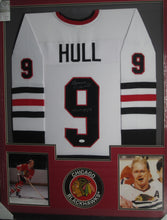 Load image into Gallery viewer, Chicago Blackhawks Bobby Hull Signed Jersey with HOF 1983 Inscription Framed &amp; Matted with JSA COA