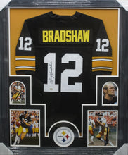 Load image into Gallery viewer, Pittsburgh Steelers Terry Bradshaw Hand Signed Autographed Black Jersey Framed &amp; Matted with COA