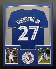 Load image into Gallery viewer, Toronto Blue Jays Vladimir Guerrero Jr Hand Signed Autographed Custom Blue Jersey Framed &amp; Matted with COA