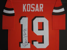 Load image into Gallery viewer, Cleveland Browns Bernie Kosar Hand Signed Autographed Orange Jersey Framed &amp; Matted with PSA COA