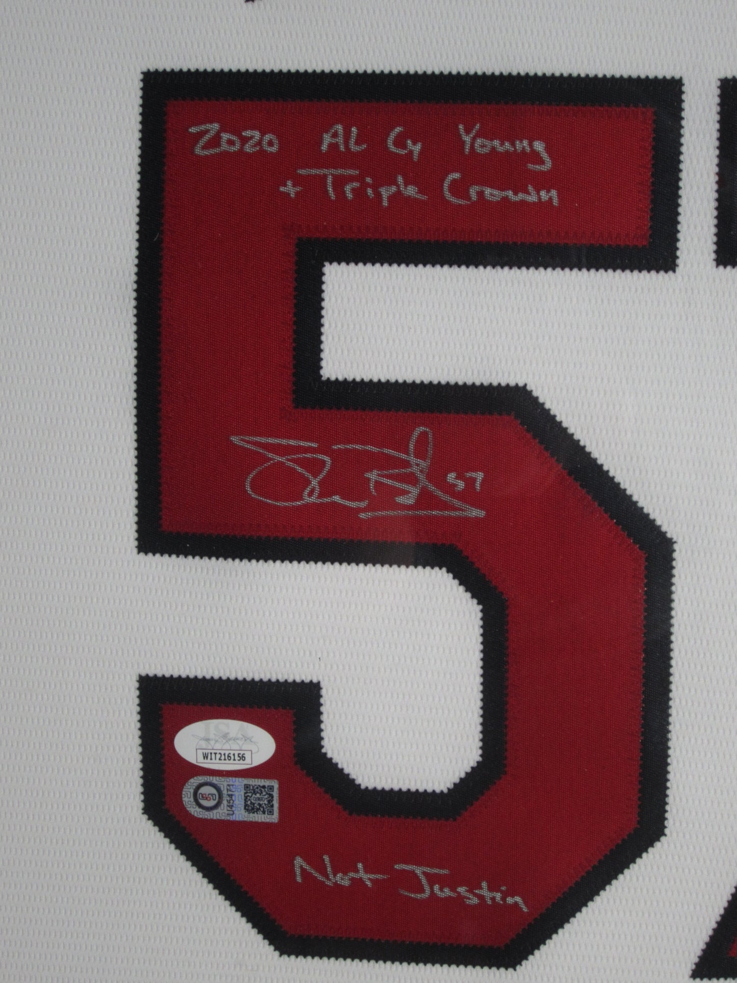 Cleveland Indians Shane Bieber Hand Signed Autographed Jersey with 2020 AL CY Young + Triple Crown & Not Justin Inscriptions Framed & Matted with JSA COA