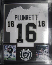 Load image into Gallery viewer, Oakland Raiders Jim Plunkett Signed Jersey with S.B. XV MVP Inscription Framed &amp; Matted with JSA COA